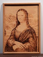 Framed wood-burned Mona Lisa portrait front view