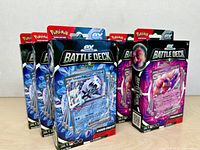 Front view of six sealed ex Battle Deck boxes, three Chien-Pao and three Tinkaton versions.