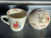Mug and coin bank together, showing size and designs
