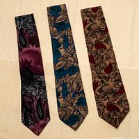 All three silk ties laid flat showing full patterns