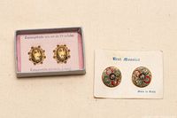 Both pairs of earrings shown with original packaging