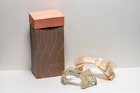 Full view of Eaton's box, satin bow, lace headpiece