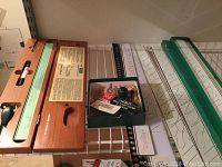 Wooden boxed tooling sets on metal shelving showing Leroy Scriber and lettering templates