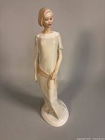 Full front view of figurine showing entire piece and condition