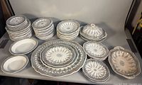 Entire set of stacked plates, bowls, platters, covered serving bowl