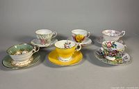 Group shot of all six teacup and saucer sets