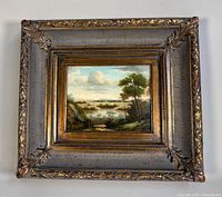 Full view of framed oil painting