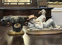 Both figurines side by side on table