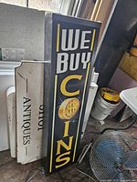 Full view of vertical light box sign showing graphics and lettering