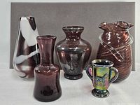 Group shot of all five amethyst glass pieces