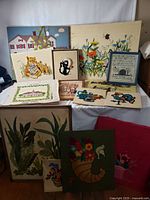 Group view of all crewel pieces