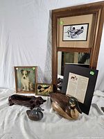 Group shot showing all items including mirror, framed artworks, duck decoy, figurines and planter