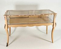 Full view of wooden framed glass display case table