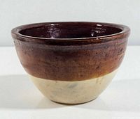 Side and interior view of two-tone stoneware bowl