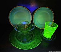 Group glow view of all five uranium glass pieces