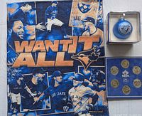 Rally towel, boxed ornament, coin set displayed together