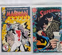 Cover of Madman Comics #1 and Superman holiday issue side by side in sleeves