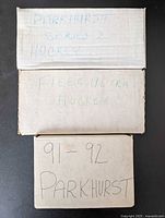 Three cardboard boxes labeled Parkhurst Series 2, Fleer Ultra, and 91-92 Parkhurst.