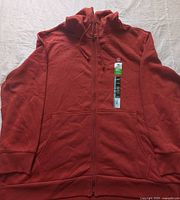 Full front view of Gildan burnt orange-brown zip hoodie with tags attached