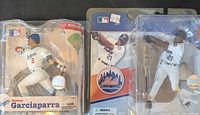 Front view of both packaged figures: Garciaparra Dodgers #5 and Delgado Mets #21