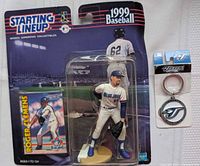 Front view of sealed Roger Clemens Starting Lineup figure package beside Blue Jays keychain card