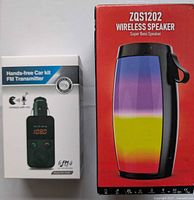Front of both boxed items: ZQS1202 speaker and FM transmitter packaging