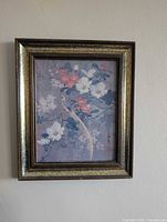Full view of framed Asian art print hanging on wall