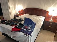 Headboard, mattress, both nightstands visible