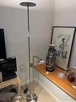 Full view of IKEA ISJAKT floor lamp beside other items