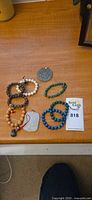 Group shot of all bracelets and pendants