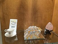 All three items displayed together on glass shelf