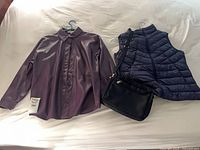 Group shot of jacket, vest and purse