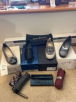 All shoes, umbrellas, clutch and boxes overview