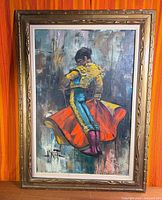 Full view of framed matador oil painting