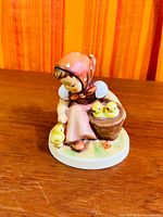 Full view of Hummel Chick Girl figurine front angle