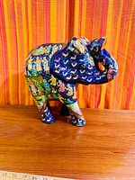 Front/left view showing painted scenes and overall form