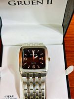 Watch in open Gruen II box showing dial and bracelet