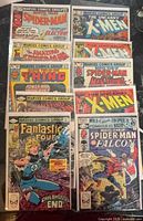 Front view of eight bagged Bronze Age Marvel comics showing cover titles