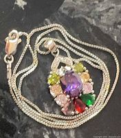 Necklace coiled showing pendant, lobster clasp and chain links