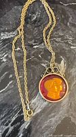 Necklace showing pendant portrait side and full chain