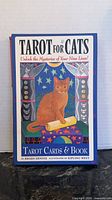 Front of boxed set showing title and cat illustration