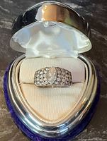Heart-shaped box with sterling silver pavé ring displayed