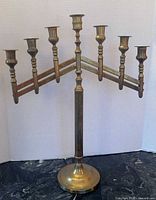 Full frontal view showing seven arms and base