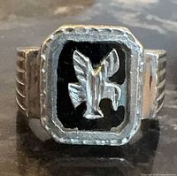 Front view of sterling silver eagle onyx signet ring