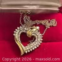 Heart pendant necklace full view on red background