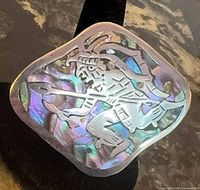 Front view showing Aztec warrior design and abalone inlay