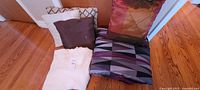 Group shot showing comforter, blanket and four pillows