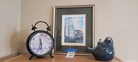 Full lot showing framed print, alarm clock, ceramic bird