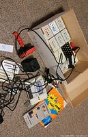 Overall lot with computer, joysticks, datasette, power adapter, cassettes, manuals and cables