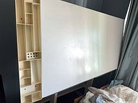 Full view of white drafting surface with side storage compartments